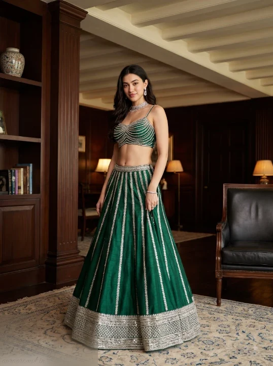 Indian girl in emerald green paneled lehenga standing in dark mahogany library interior, AI lehenga photo prompt full body
